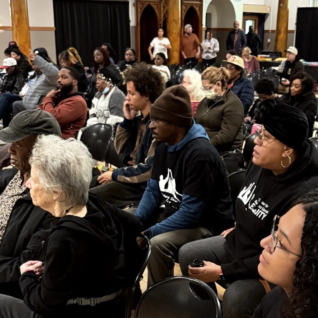 A packed community meeting